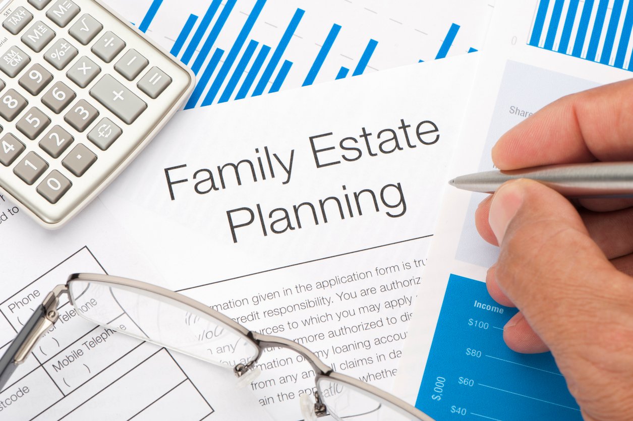 Family Estate planning document with writing hand